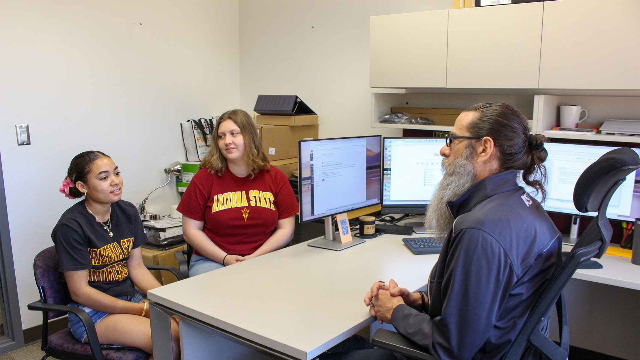 Students talking to a professor